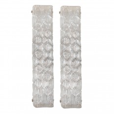 Pair of textured glass sconces featuring a wave pattern